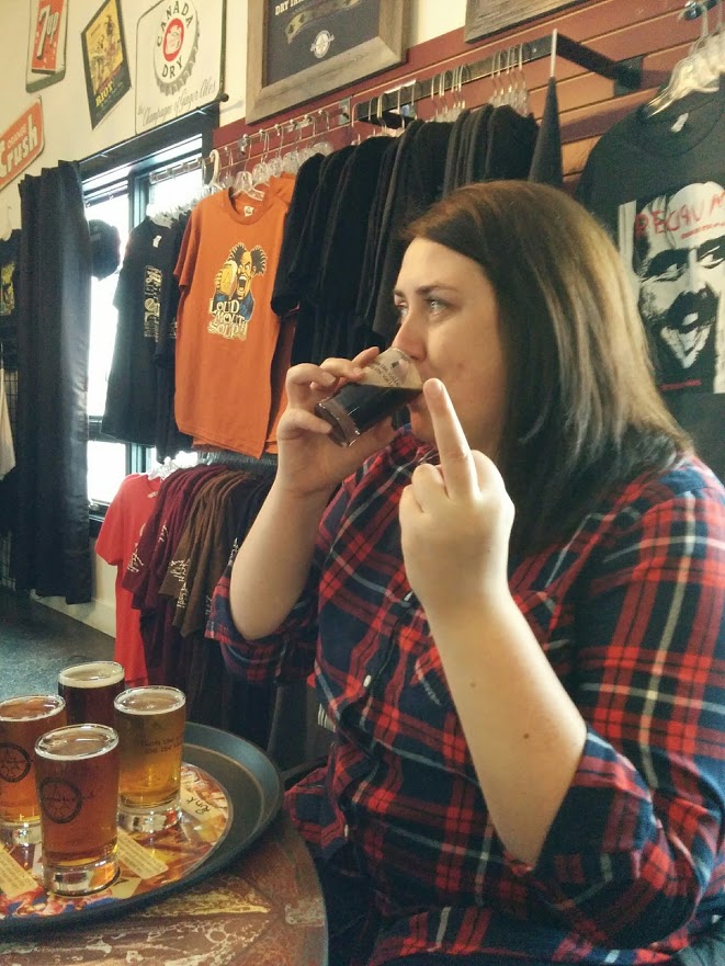 Me drinking a beer, and giving the camera the middle finger.