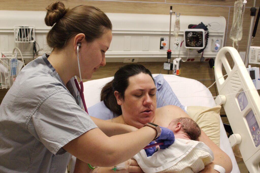 Me, holding my newborn son.
