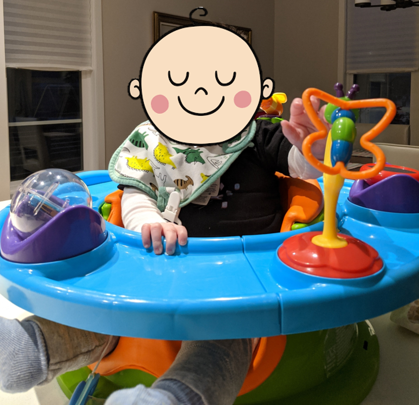 My son in a plastic seat.